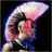 Pixelated static icon of a stylized character with pink and blue color scheme against black background, featuring exaggerated facial features and abstracted hair shape.