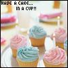 Pixelated image of cupcakes with pink and blue frosting on a white plate, overlaid with text reading 'HAVE A CAKE... IN A CUP!!'