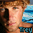 A pixelated image of a person with light brown hair and blue eyes, wearing no shirt, against a beach background with blue water and white waves.