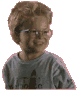 A child with short brown hair and glasses wears a gray shirt, first facing forward then turning right while smiling.