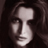 Pixelated grayscale portrait of a person with long dark hair, featuring soft lighting and visible facial features including eyes, nose, mouth, and cheekbones within a 48x48 static icon frame.