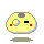 Yellow rounded character with gray spot, red cheeks, black eye, and blue outline; two versions show different mouth shapes and Japanese text above.