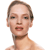 Pixelated close-up of a person with light skin tone, brown hair pulled back, and a brown choker necklace against a white background.