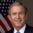 A pixelated image of a man in a suit with an American flag background, displaying text that reads "America can do better" in