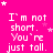 Bright pink background with white pixelated text repeating "I'm not short. You're just tall." and scattered white stars.