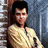 Pixelated image of a person in a yellow striped shirt against a brick wall, with pink and gray text reading "Everyone has a little bit of Ducky in them. :)"