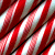 Red and white striped candy cane pattern on left, green background with pixelated text 'Original Icons .com' on right.