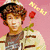 A pixelated image of a person with curly brown hair holding a red rose against a pink background, with yellow text reading 'NICK' above.