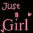 Pixelated pink text 'Just a Girl' on black background with small floating heart shapes.