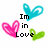 Pixelated heart-shaped icons in blue, pink, and green with text "Im in Love" and "<3" on a white background.