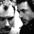 Two stylized human faces in grayscale, side-by-side with a bright white vertical split between them against black background.
