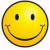 A static buddy icon featuring a yellow smiley face with black eyes and mouth on the left, next to green pixelated text reading "Put a smile on =)" on the right against a white background.