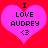 Two identical pink hearts on red background with black text 'I LOVE AUDREY <3' inside each heart.