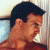 A pixelated image of a person with dark hair resting their head on a light-colored surface, next to green text reading 'Original Icons .com' in bright green letters.