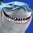 Pixelated shark head with wide open mouth showing teeth, blue background, gray and light blue color scheme, static image.