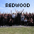 Pixelated image of a marching band with text labels above and below the scene.