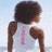 A four- shows a woman in white, pink dog silhouette on yellow, blue 'PINK' text with small pink dog, and 'PINK IN THE CLOUDS' text