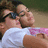 Two people in a close embrace, one wearing sunglasses and a white shirt, the other in a pink patterned top, with text 'Zac & Vanessa' in pink pixelated font on a dark blue background.