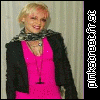 A woman in a bright pink dress and black jacket poses in three distinct expressions and arm positions against a light striped background.