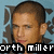 Pixelated image of a person with short brown hair against light blue background, text below changes from 'orth miller' to '<333333'