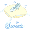 Pixelated image of a light blue glass slipper on a cream pillow with snowflakes and 'Sweets' text below.