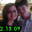Two people pose closely together in a pixelated image with green text overlay reading '2.13.09' at the bottom left.