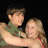 Two people embrace against a dark background with red text overlay reading "Cody and Danielle 01/04/07" on the right side.