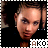 A pixelated image of a person with curly hair wearing a black top, with the text 'AKO' below in brown and white letters.