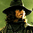 A pixelated figure in a wide-brimmed hat and dark clothing holds a glowing object against a green background, with "VAN HELSING" text on the right.