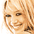 Pixelated image of a smiling blonde woman with two versions: one unmarked, one crossed out by black X lines; text labels below and to the right.