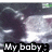 Pixelated image with dark purple and gray background, white light burst effect, and black text reading 'My baby' at bottom.