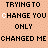 Pixelated text repeats across a peach background with animated white-to-black letter transitions in 'TRYING TO CHANGE YOU ONLY CHANGED ME' phrases.