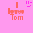 Pixelated pink background with orange text 'i lovee Tom' and a pixelated heart symbol above the text on the left side.