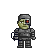 Pixelated character with greenish skin, one red eye, and gray armor standing against a plain background.