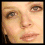 Four pixelated close-up of a person's face arranged in a , each showing different facial expressions and angles