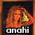 A pixelated image of a woman with long curly hair wearing an orange top and black bottoms, overlaid with text labels.