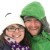 Two pixelated figures in close proximity; one wears a green knit hat and dark clothing, the other has brown hair and purple attire.