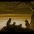 Animated scene with silhouetted figures on a hill against a sunset sky, paired with green text reading "Where will their destiny take them...".