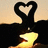 Animated icon with four quadrants: top-left shows two hands forming a heart shape over a candle, top-right displays "Love Forever" text on yellow background, bottom-left has "You and Me" text on yellow background, bottom-right is gray.