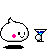 Pixelated white blob character with pink circular cheek, black eyes, and a smile, holding a blue martini glass with a white sphere, casting a black shadow.