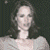 A pixelated image of a person with long dark hair and light clothing against a dark background, next to green text reading 'Original Icons .com' on a solid green backdrop.