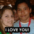 Two people pose closely together with a black banner reading 'I LOVE YOU!' in white pixelated text at the bottom.