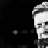 Black-and-white pixelated image of two partial faces with one face on a white background and the other on black, showing hair texture and facial features.