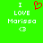 Green background with white pixelated text reading "I LOVE Morissa <3" and a red heart symbol above the word LOVE.