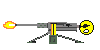 Pixel art icon of a gray machine gun with yellow accents firing orange muzzle flash, mounted on green tripod legs, featuring a yellow smiley face with black eyes and mouth at the rear.