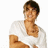 Pixelated image of a person in white clothing with arms crossed, next to blue pixel text reading 'zoc efron is hot <3' on white background.