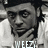 Black-and-white pixelated image of a person with hand near chin, displaying text 'WEEZY', 'EFF', and 'BABY' across three