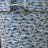 A static pixelated image with no discernible subjects or objects, composed of scattered light and dark gray pixels forming an abstract pattern.