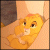 Animated pixel art of a young lion cub with golden fur, brown eyes, and a small pink nose resting on a light tan surface against a dark gray background.
