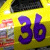 Animated contact sheet of a yellow race car icon with purple number 36, showing motion blur and frame transitions across seven sampled frames.